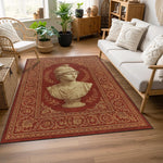 Merkezde antik erkek heykel portresi bulunan, çevresi yoğun bitkisel ve geometrik motiflerle çerçevelenmiş bordo zeminli halı; klasik dokuma estetiği, simetrik yüzey düzeni ve sanat tarihinden ilham alan güçlü görsel kompozisyon.