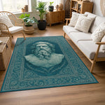Merkezde antik filozof heykelini andıran sakallı erkek portresi bulunan, turkuaz zeminli klasik stil halı; mermer hissi veren yüzey dokusu, dengeli simetri, zarif floral desenler ve sanatsal yüzey düzeni.