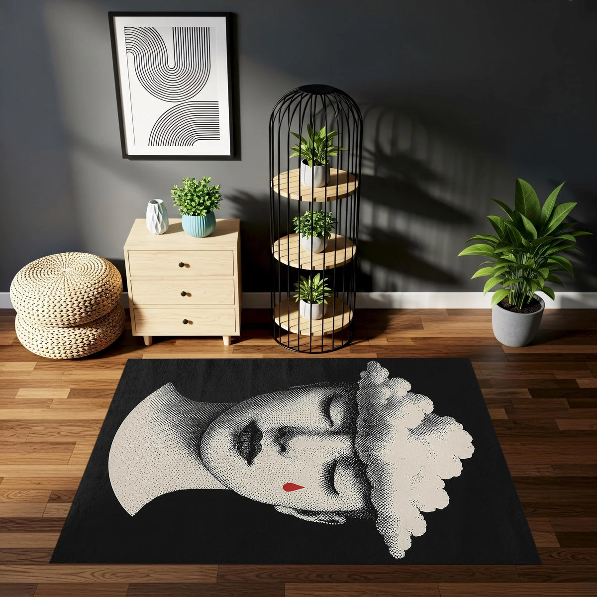 Sürreal figürlü dikdörtgen halı; kapalı gözlü kadın yüzü, bulut formu ve tek kırmızı damla motifiyle tasarlanmıştır. Monokrom renk yapısı sade bir zemin oluştururken, kırmızı detay dikkat çekici bir görsel etki yaratır.
